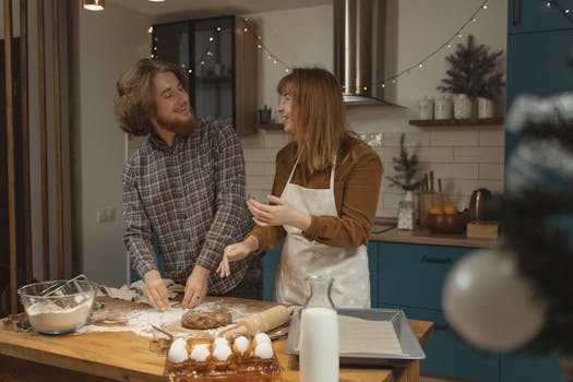 a cheerful young woman cooking in her kitchen